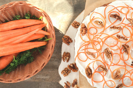 Delicious carrot cake on wooden boardの写真素材