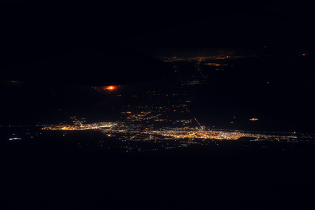Night view of big city from airplane windowの写真素材