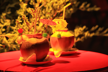 Fresh coconut water drinks on table at tropical resortの写真素材