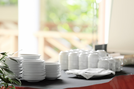 Dishware on table in modern cafe