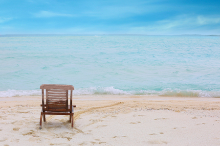 Beach chair on sea shore at resortの写真素材