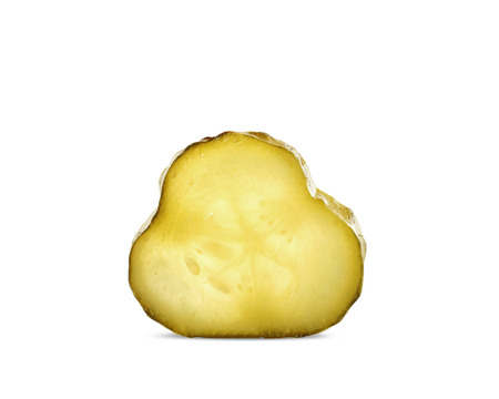 Slice of pickled cucumber isolated on white backgroundの写真素材
