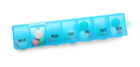 Container with pills on white backgroundの写真素材