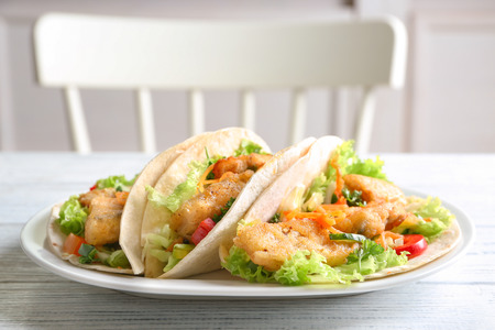 Plate with delicious fish tacos on table, closeupの写真素材