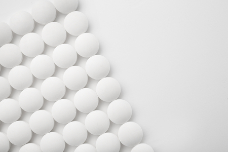 Round pills on white backgroundの写真素材