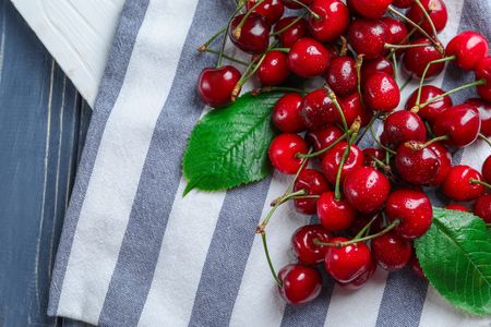 Tasty ripe cherries on tableの写真素材