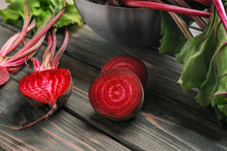 Fresh young beets on wooden tableの写真素材