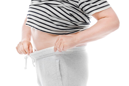 Overweight man on white background. Diet conceptの写真素材