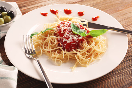 Delicious pasta with tomato sauce on plateの写真素材