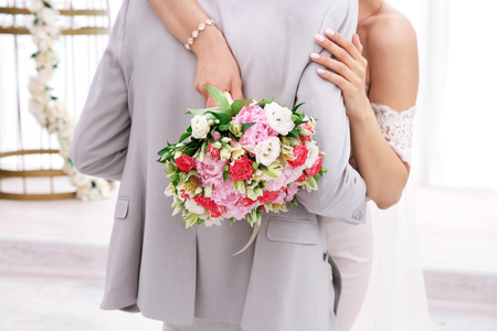 Happy beautiful couple on wedding day, indoorsの写真素材