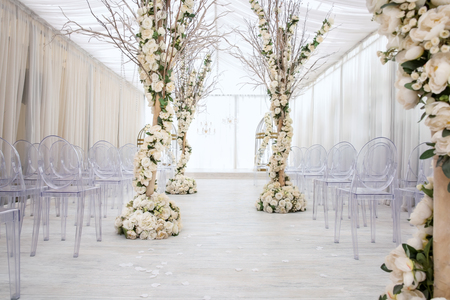 Beautiful wedding hall decorated with flowersの写真素材