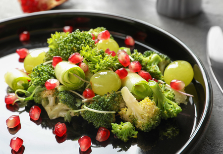 Plate with broccoli salad on tableの写真素材