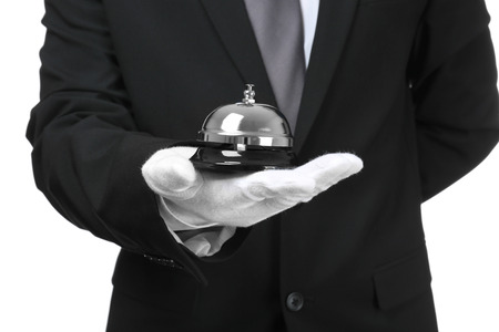 Man holding bell on white background, closeupの写真素材