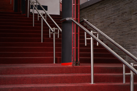 Red carpet on stairs of building, outdoorsの写真素材