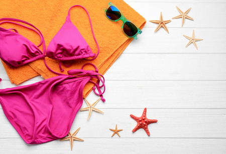 Beach accessories on wooden background. Vacation conceptの写真素材