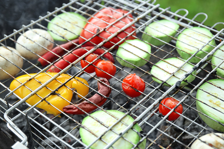 Cooking of appetizing juicy vegetables outdoorsの写真素材