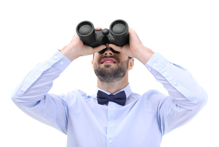 Handsome young man with binocular on white backgroundの写真素材
