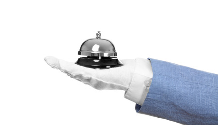 Man holding bell on white backgroundの写真素材