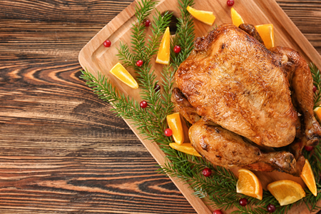 Roasted turkey on wooden boardの写真素材