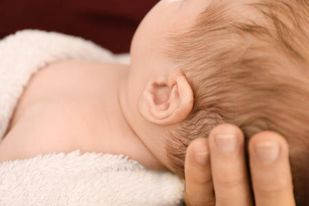 Cute little baby with father at home, closeupの写真素材