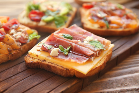 Tasty sandwiches on wooden board, closeupの写真素材