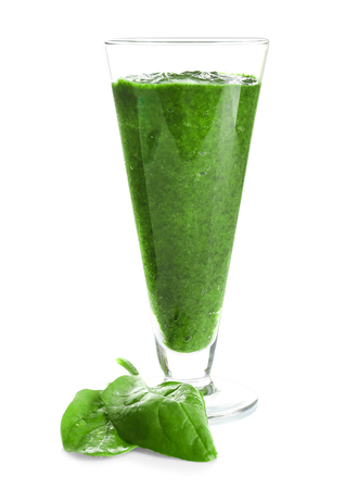 Glass of spinach smoothie isolated on whiteの写真素材