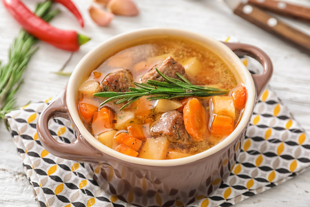 Casserole with tasty meat and potatoes on tableの写真素材