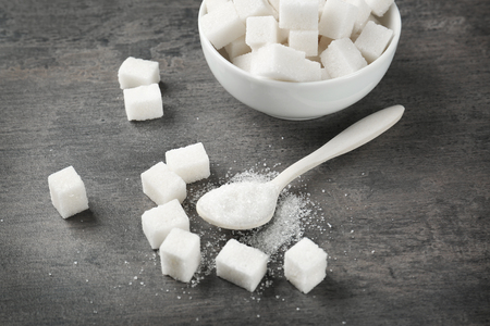 Refined white sugar on grey tableの写真素材