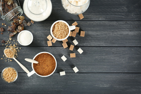 Various kinds of sugar on grey tableの写真素材