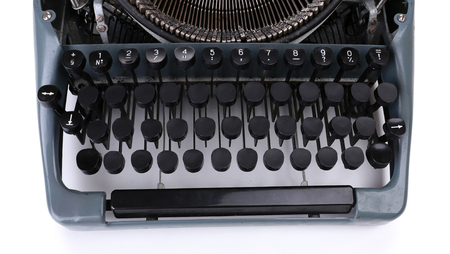 Antique Typewriter. Vintage Typewriter Machine, isolated on white backgroundの写真素材