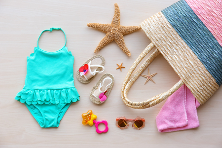 Summer accessories on wooden background. Holiday conceptの写真素材