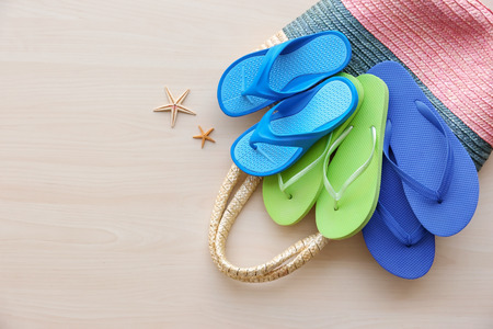 Summer accessories on wooden background. Holiday conceptの写真素材
