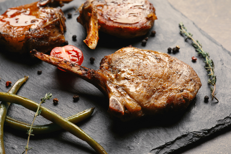 Slate plate with grilled meat, closeupの写真素材