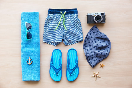 Summer accessories on wooden background. Holiday conceptの写真素材