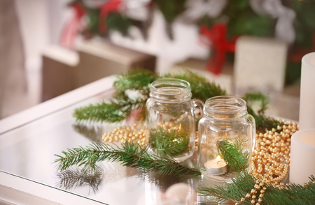 Table with beautiful Christmas decorations in living roomの写真素材