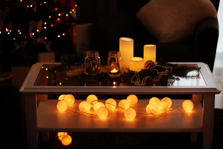 Table with beautiful Christmas decorations in living room