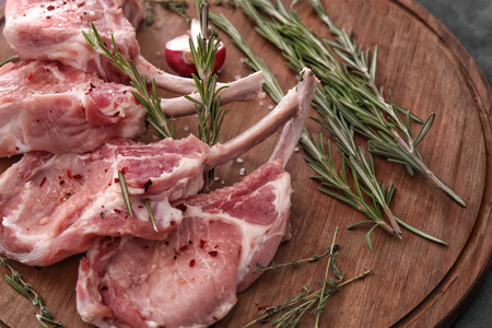 Raw ribs and seasoning on kitchen tableの写真素材