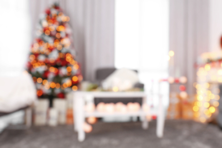 Blurred view of decorated living room with beautiful Christmas treeの写真素材