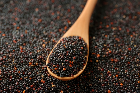 Spoon with quinoa on seedsの写真素材