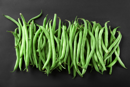Fresh green beans on dark backgroundの写真素材