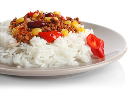 Chili con carne served with rice on plate against white backgroundの写真素材