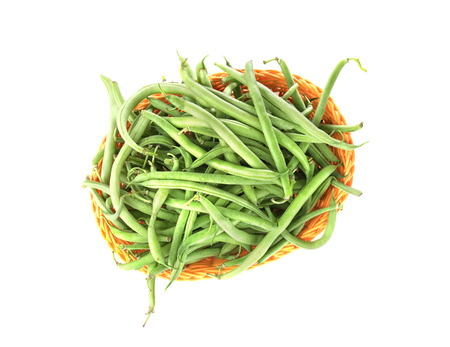 Wicker basket with fresh green beans on white backgroundの写真素材