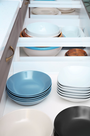 Set of tableware in kitchen drawersの写真素材