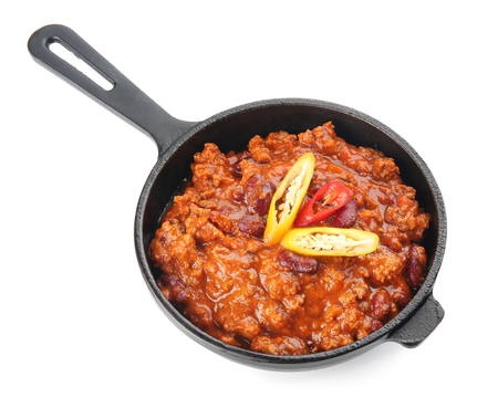 Chili con carne in frying pan on white backgroundの写真素材