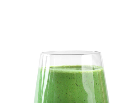 Glass of fresh green smoothie on white backgroundの写真素材