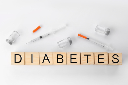 Composition with word Diabetes and syringes on light backgroundの写真素材