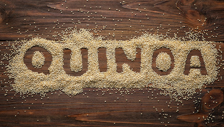 Word made from grains of quinoa on wooden tableの写真素材