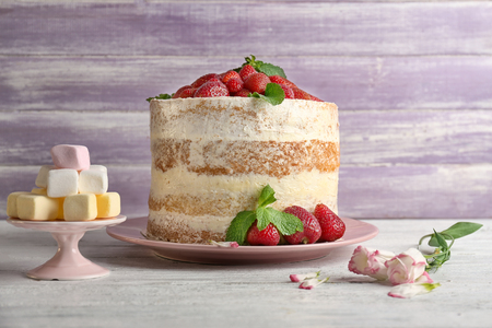 Delicious strawberry cake on wooden tableの写真素材