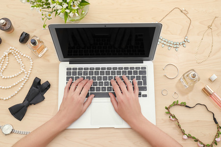 Woman working with laptop at tableの写真素材