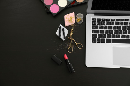 Comfortable workplace of beauty blogger with modern laptop on tableの写真素材